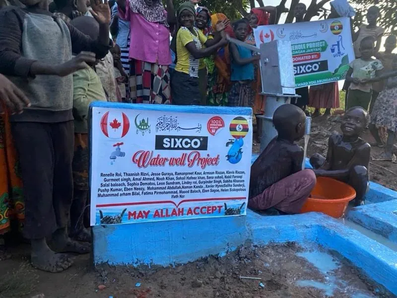 The community around a Sixco-funded water well in Uganda